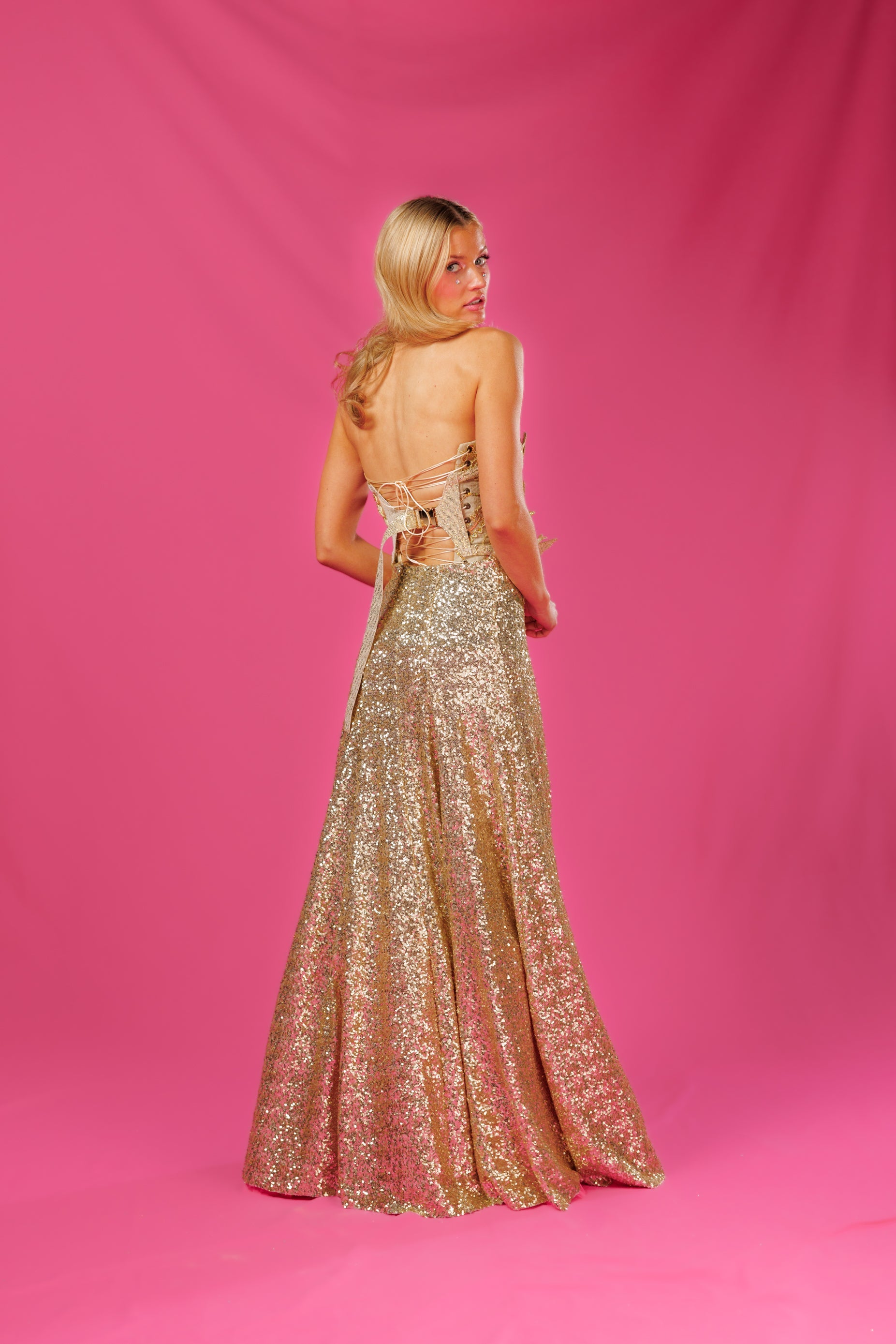 Back view Floor length sparkly gold sequin gown
